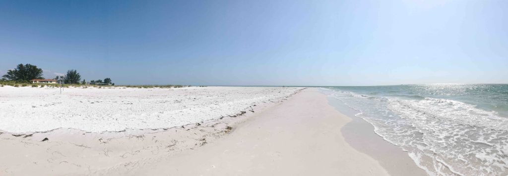 Panoramic photo of Bean Point Beach on the northernmost tip of Anna Maria Island.