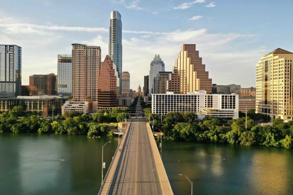 Skyline of Austin, Texas with Lady Bird Lake in the foreground.
