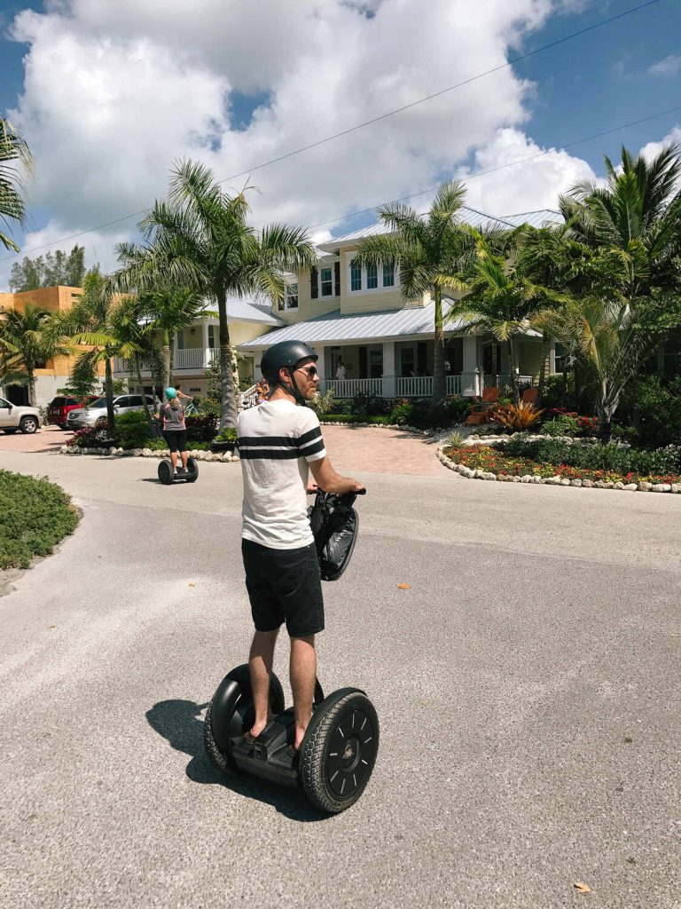 My husband riding a Segway through the streets of anna maria island on a Segway tour.