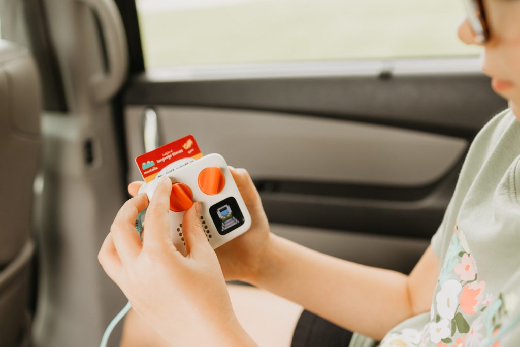 Our child using a yoto mini on a road trip.