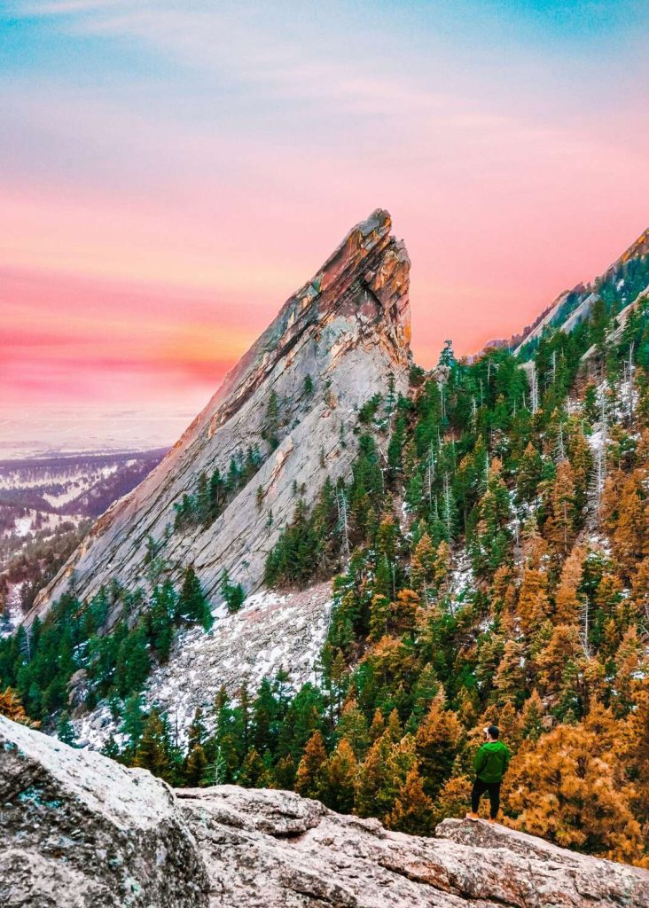 Colorful sunset behind the flatirons in Boulder, Colorado.