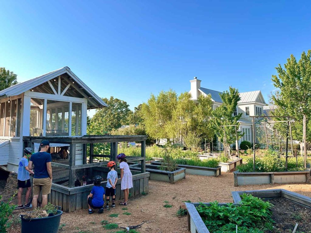 Community garden with chicken coop in Carlton Landing, Oklahoma.