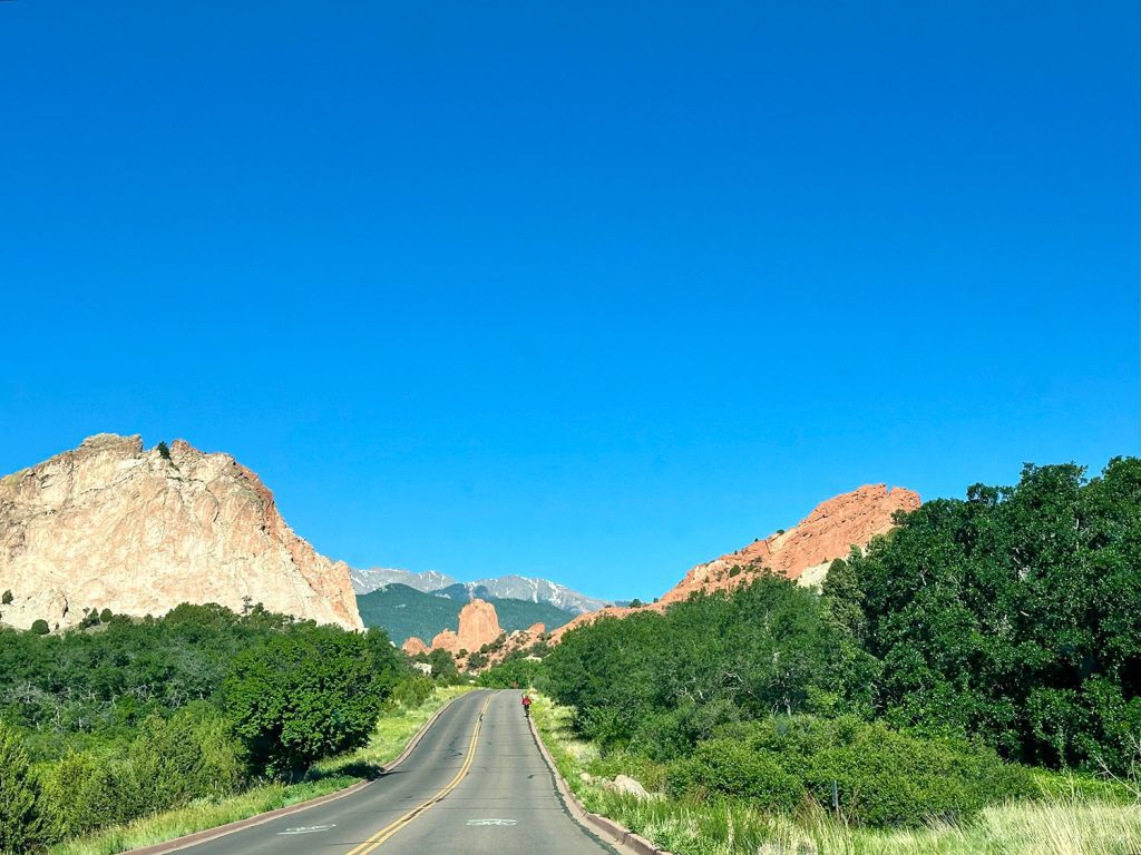 Road winding through the Garden of the Gods taking you to your perfect day trip from Colorado Springs.
