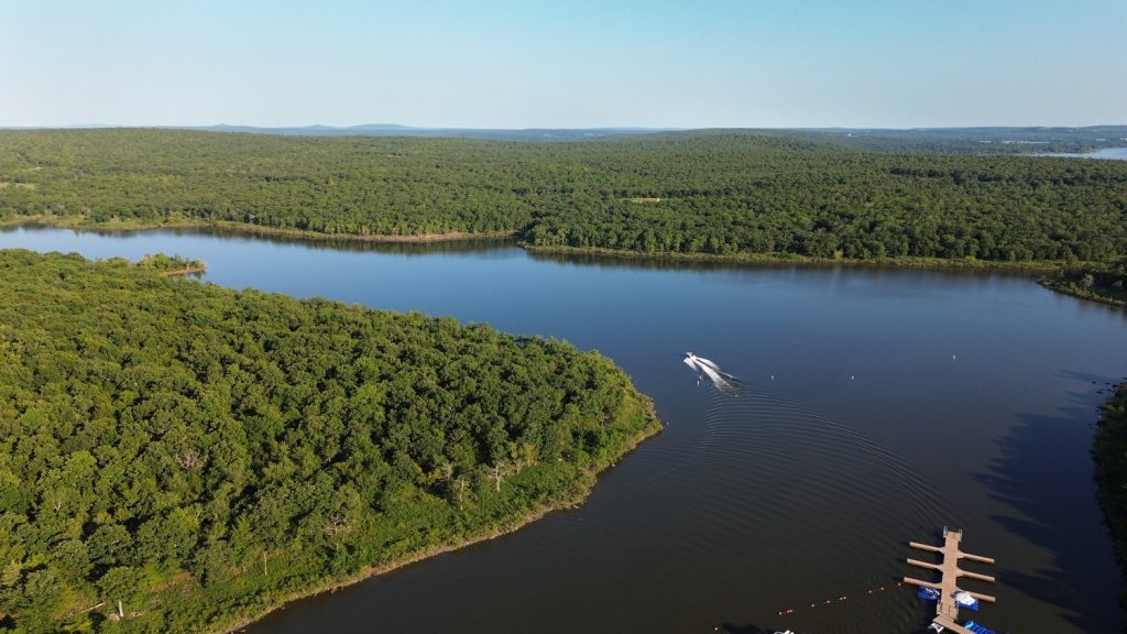 Aerial shot of Lake Eufaula with a speed boat near Carlton Landing.