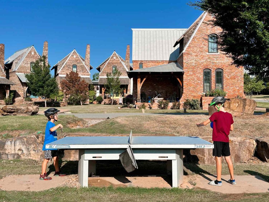 Our sons playing ping-pong on an outdoor table in Carlton Landing.