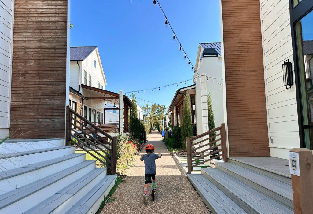 Our son scootering through the streets of Carlton Landing.