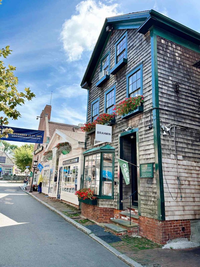 Street view of downtown Newport, Rhode Island featuring historic buildings and shops.