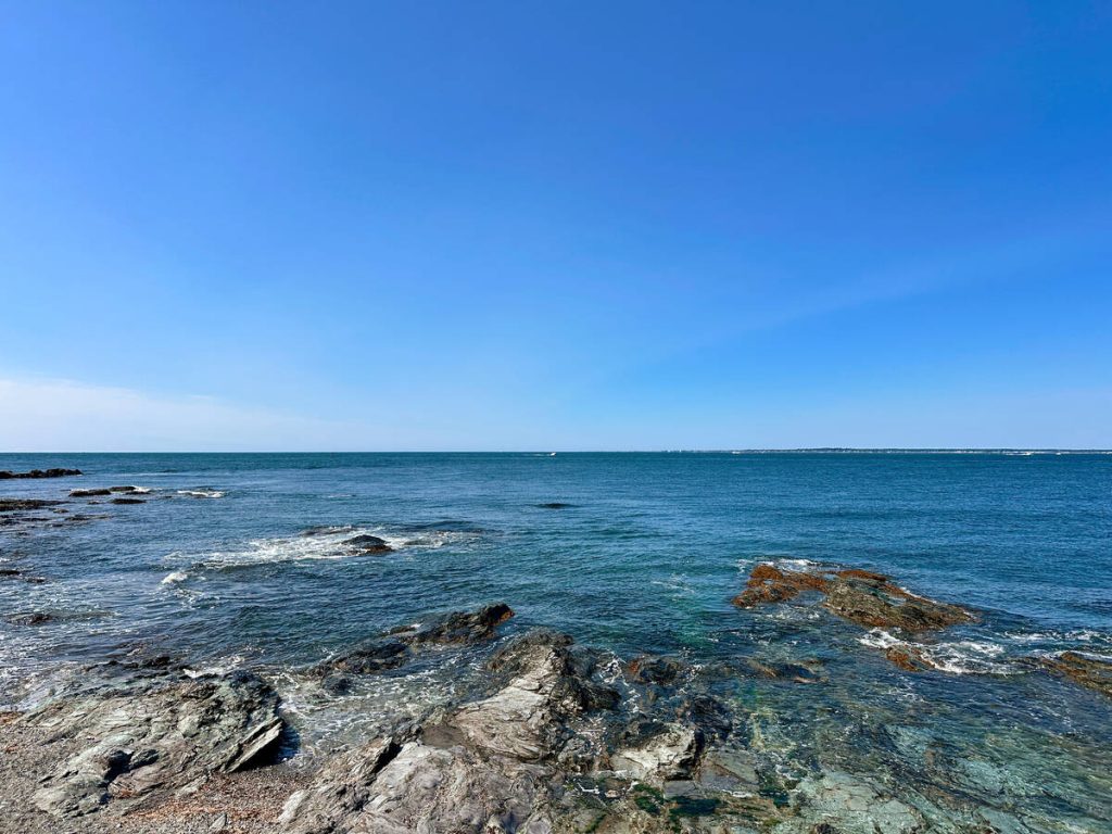 View of the Atlantic Ocean and rocky shore line at Brenton Point State Park in Newport, Rhode Island.