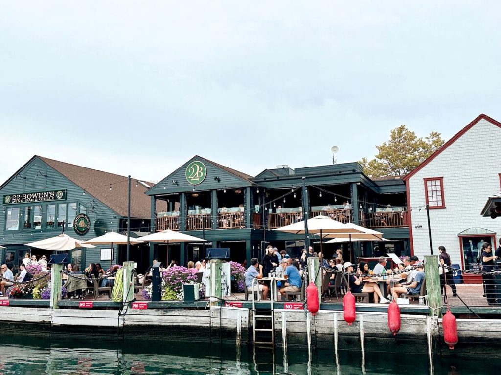 Waterfront restaurants on Bowman's Warf in Newport, Rhode Island. These restaurants have waterfront seating right on the harbor.