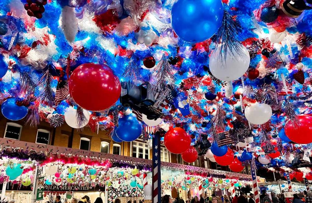 Looking up at red, white, and blue decorations at the Route 66 Christmas Chute in Sapulpa.
