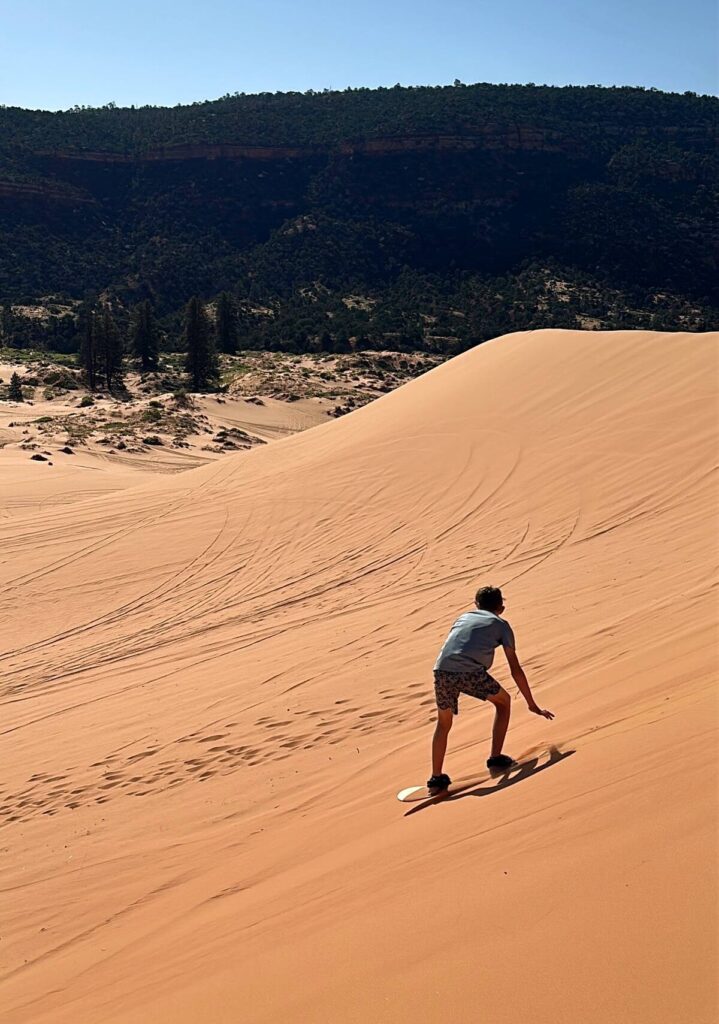 Our 13-year-old sandboarding in the sand dunes. He absolutely loved this and road the board over and over again.