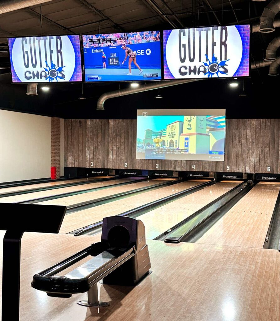 The inside of a bowling alley in Broken Bow. This bowling alley is named "Gutter Chaos". It also offers an arcade, pool tables, and outdoor seating area.