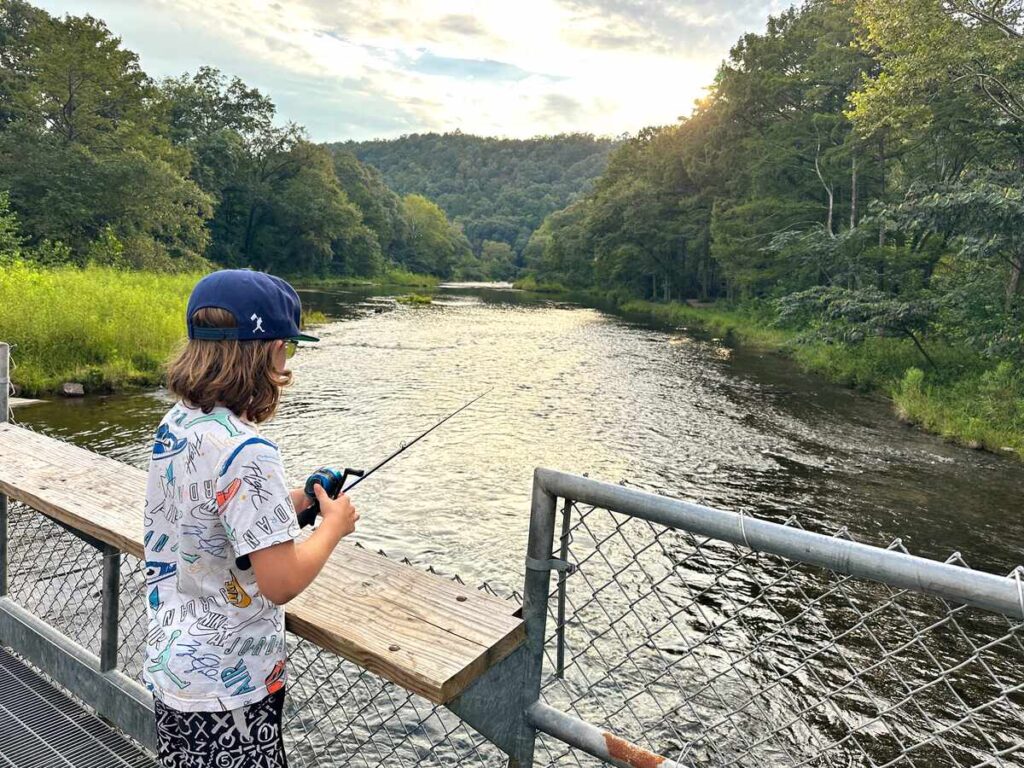 My son fishing at Beaver's Bend State Park as the sun sets.