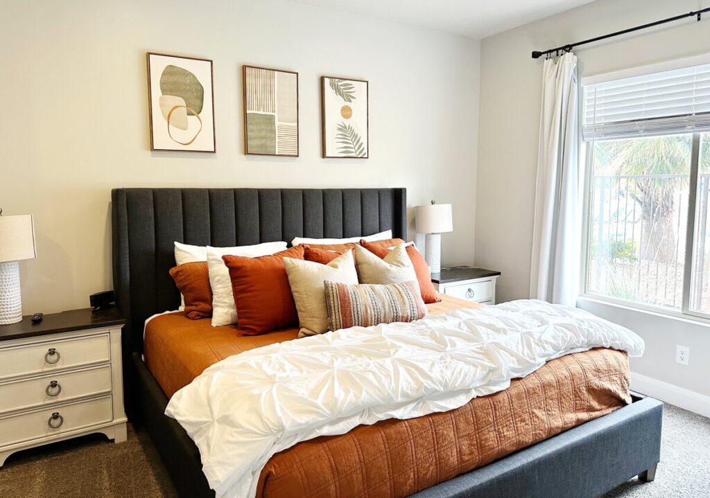 A bedroom with a beautifully made bed in our vacation rental near Zion National Park.