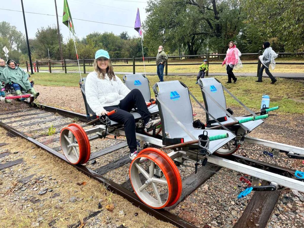 Me sitting in a railcar getting ready to ride along the railroad tracks at Joyrails OKC.
