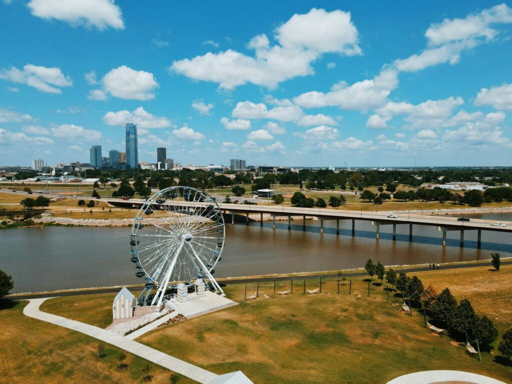 An aerial view of Wheeler Park with the downtown Oklahoma City skyline in the background.