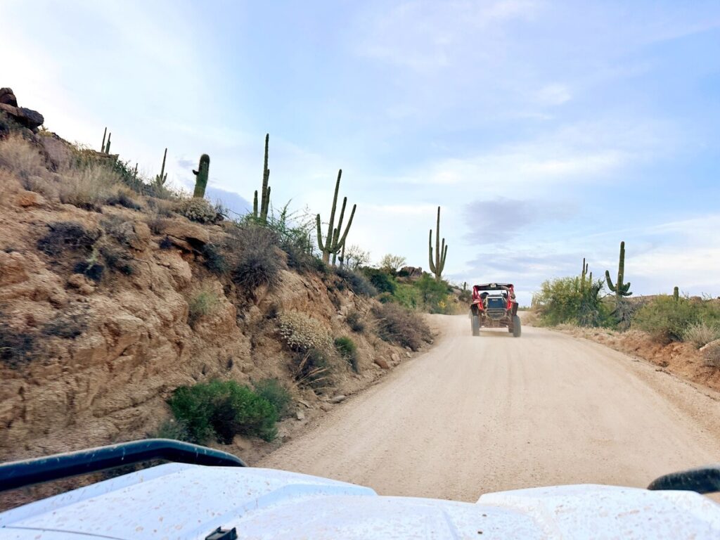 An ATV driving along a dirt trail through the desert outside Scottsdale, Arizona.